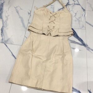 Two piece halter top skirt, cream color, size 10 genuinely leather new zipper .